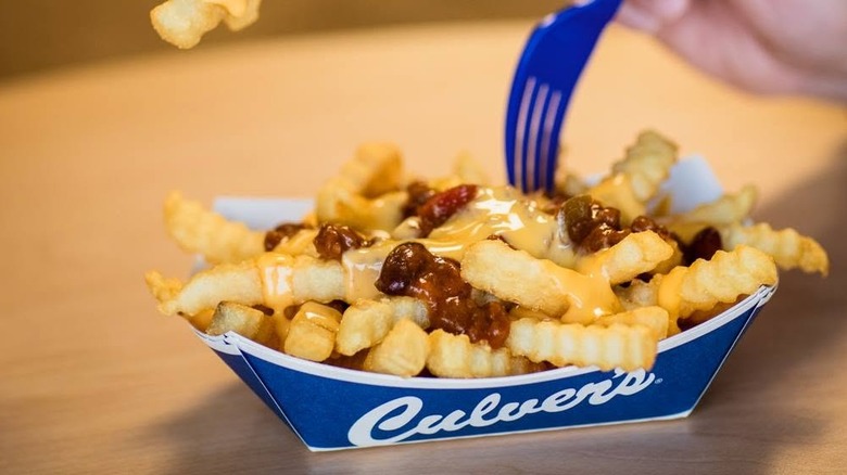 A paper boat filled with Culver's chili cheese fries