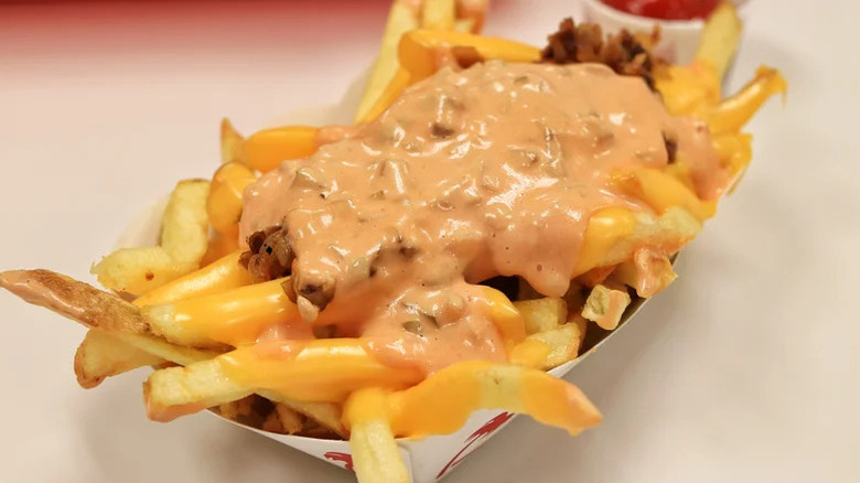 A paper boat of In-N-Out animal style loaded fries