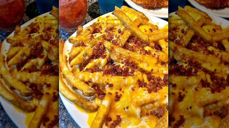 A plate of loaded Aussie cheese fries at Outback Steakhouse