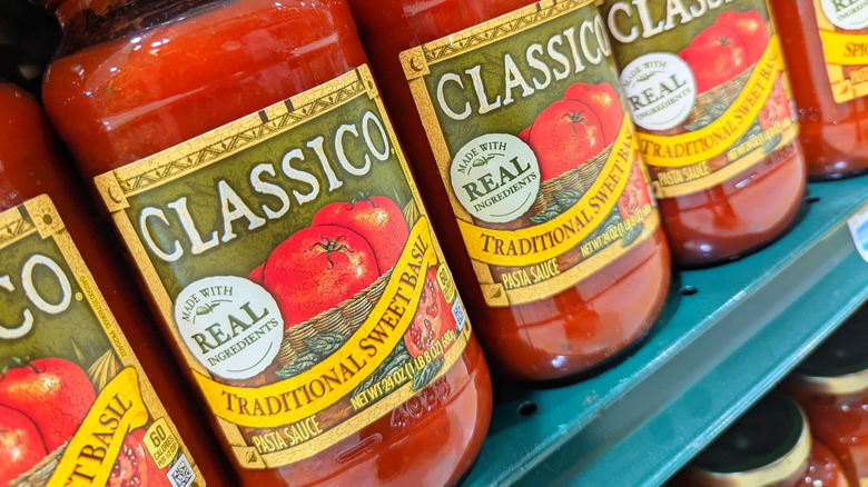 Close up of Classico tomato sauce sold on shelf.