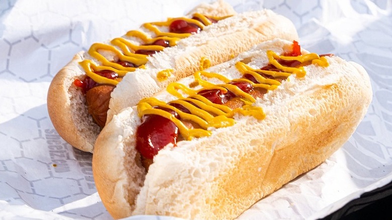 Closeup of two hot dogs with mustard and ketchup at Sheetz