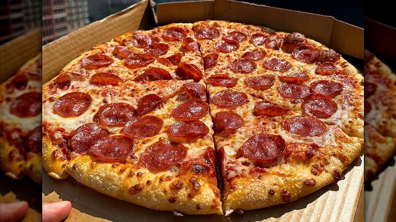 Closeup of a Pizza Hut pepperoni pizza in a to-go box