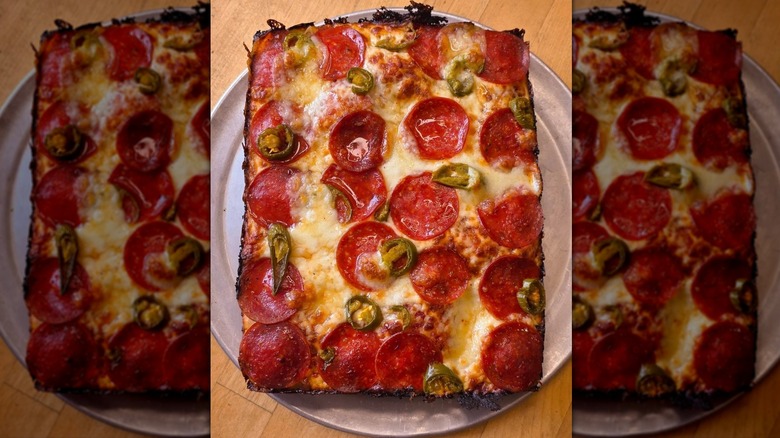 Pie Sci Detroit-style pizza topped with pepperoni and jalapeños on a silver tray.