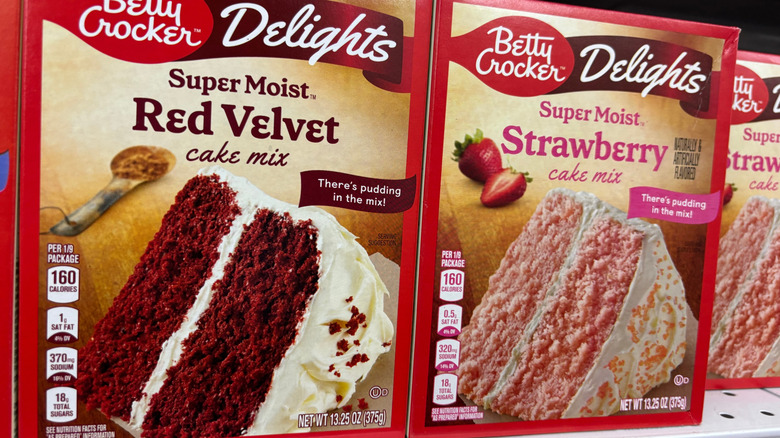 Betty Crocker boxed cake mixes sit on a supermarket shelf