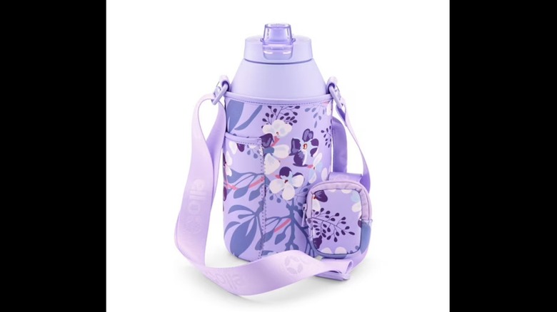 A purple water bottle in a floral carrying case