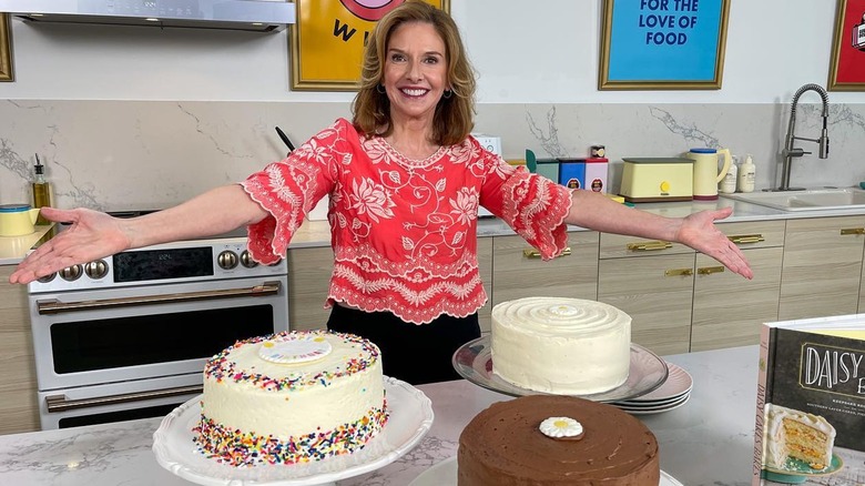 Kim Nelson behind 3 cakes