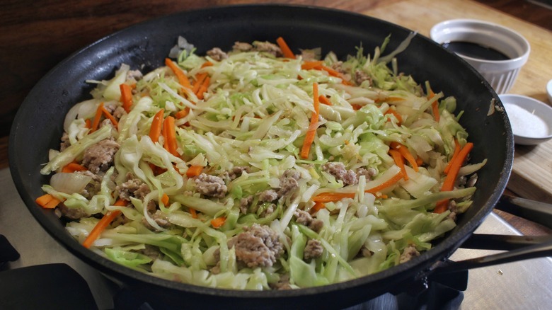 cabbage carrots pork in skillet