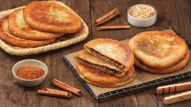 Hotteok piled on wooden cutting board