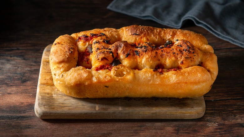 focaccia bread on wooden board 