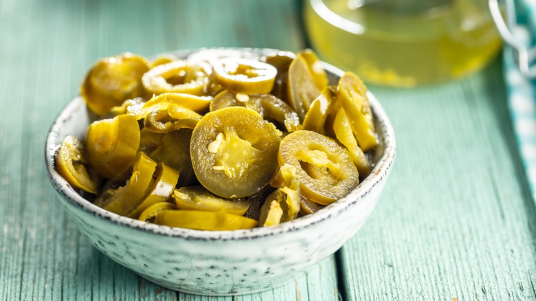Ceramic bowl of pickled jalapeños