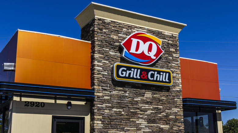 A DQ Grill & Chill storefront against a blue sky