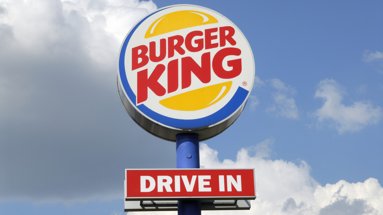 A Burger King sign against a blue sky