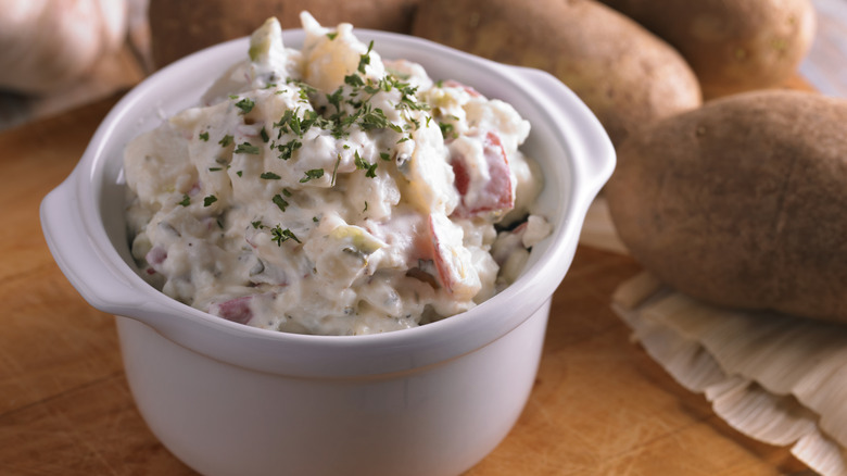 White crock of potato salad