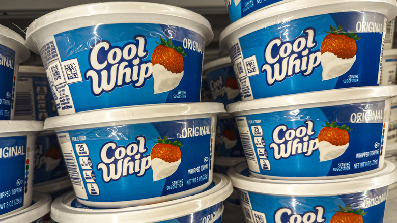 A shelf full of Cool whip containers at the grocery store.