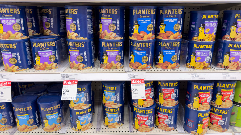 Various Planters nuts on grocery shelves.