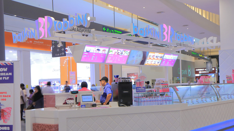 two scoops of Baskin Robbins ice cream in paper cups