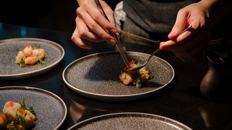 person plating food