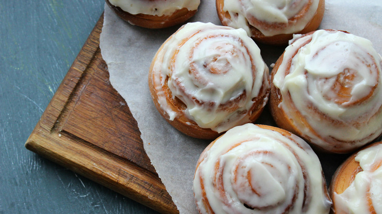 Closeup of lemon rolls on a wooden cutting board