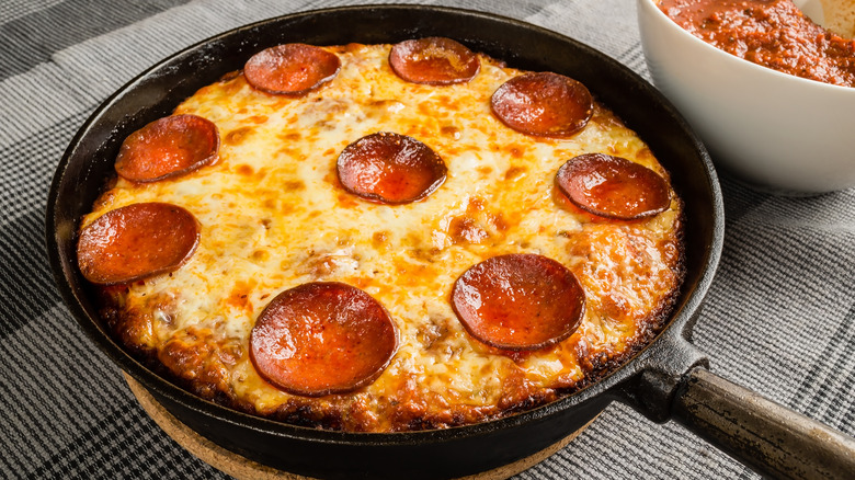 Pepperoni pizza in a cast iron pan