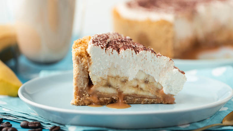 Slice of banoffee pie with caramel on bottom