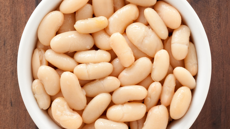 Cooked white beans in ramekin