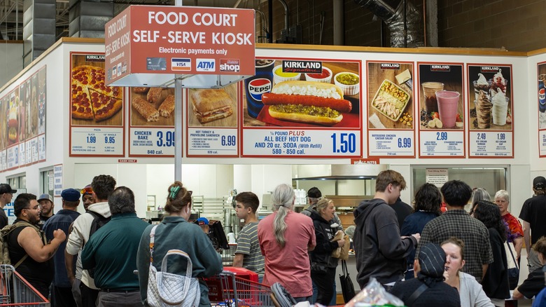 People standing in line at food court in Costco
