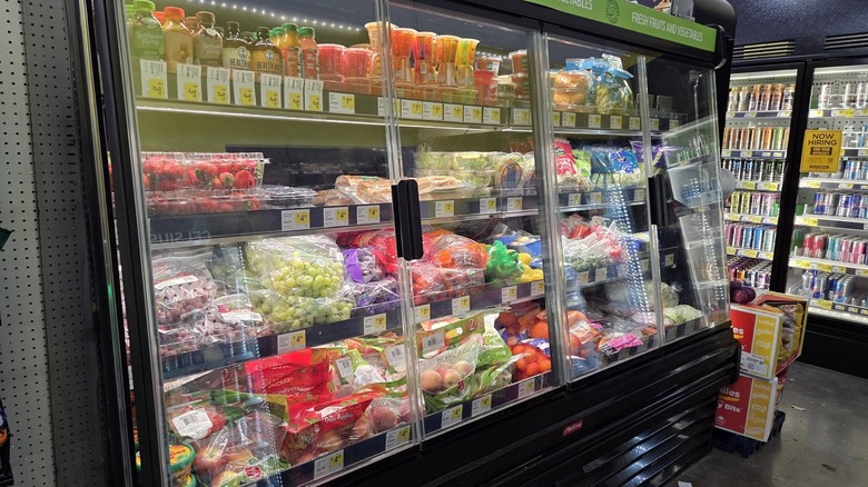 Produce sits in a case in a Dollar General.