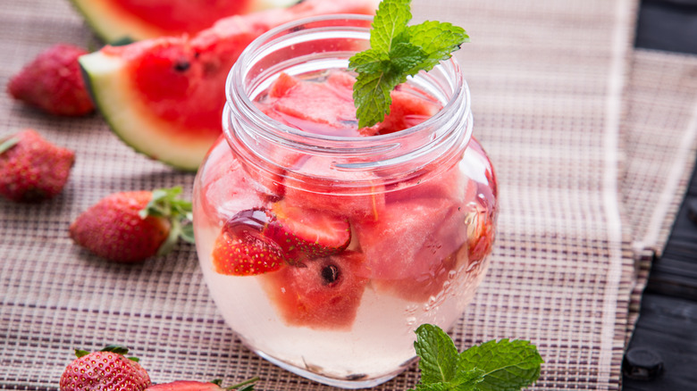 water with sliced fruit including watermelon