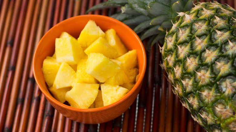 Pineapple chunks and whole pineapple