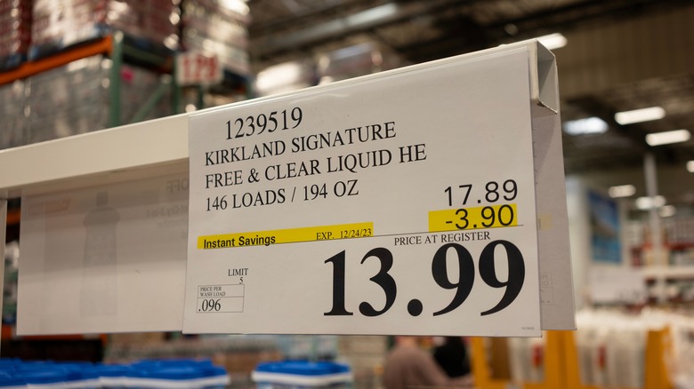 A price tag at Costco for Kirkland Signature Free & Clear liquid laundry detergent.