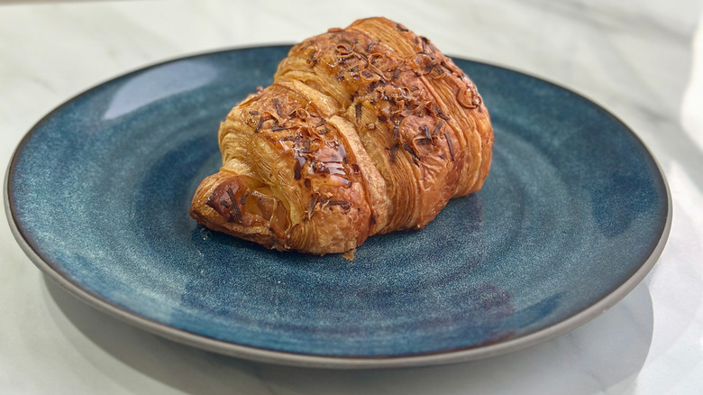 croissant pictured on a blue plate