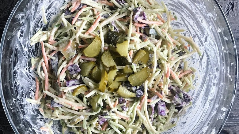 bowl of coleslaw with pickles