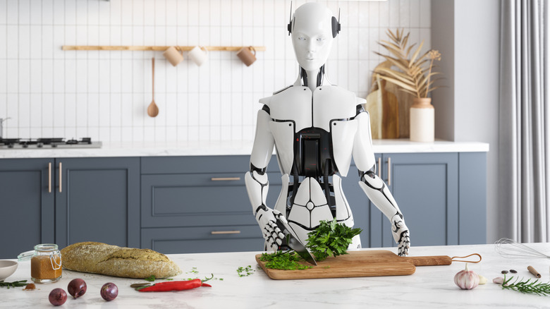 A robot chops herbs in a kitchen