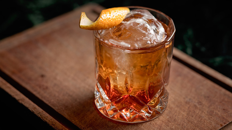 old fashioned cocktail with large ice cube