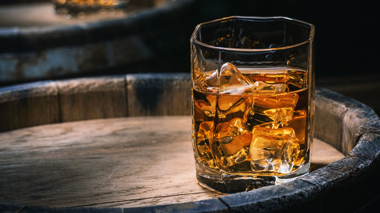 Cubed ice in whiskey cocktail