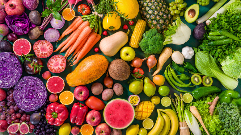 fruit and vegetables laid out on a surface