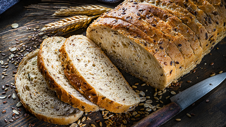 rustic artisan loaf on chopping board
