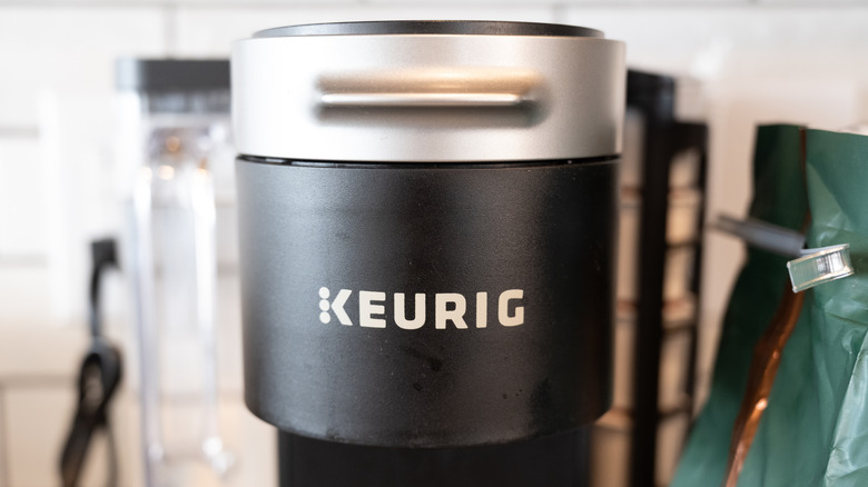The logo for Keurig is affixed to the front of the machine