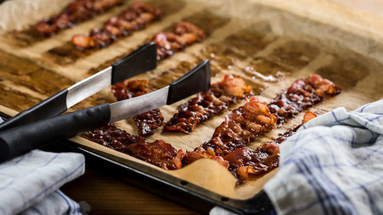 bacon roasted on parchment paper lined baking sheet