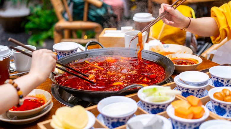 Diners enjoying Chinese hot pot