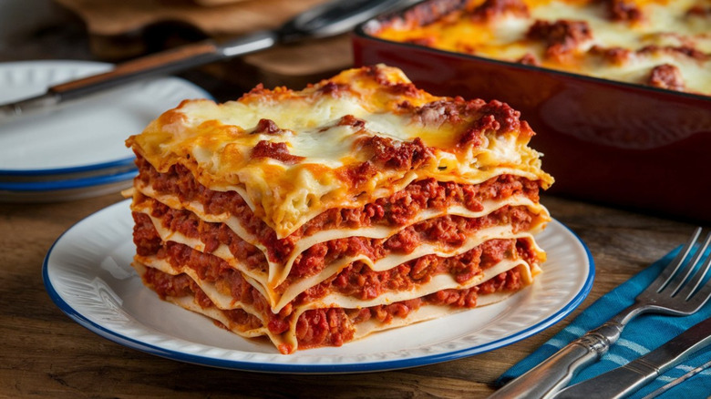 A piece of lasagna bolognese on a white plate