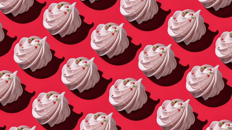 Arrangement of meringues on a red background