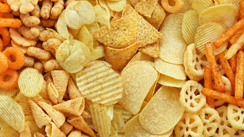 Colorful mix of chips, including Pringles and Bugles