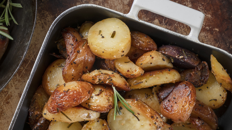 Crispy roasted potatoes on baking sheet