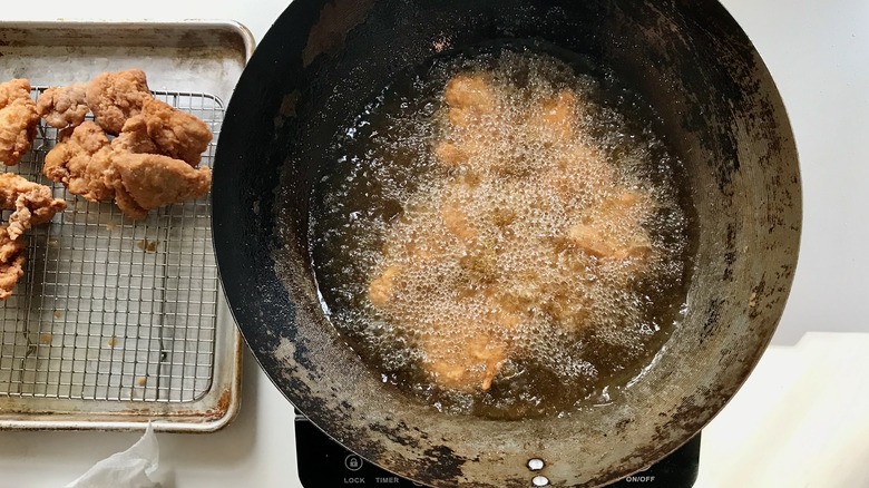 chicken frying in oil