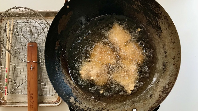 chicken frying in oil