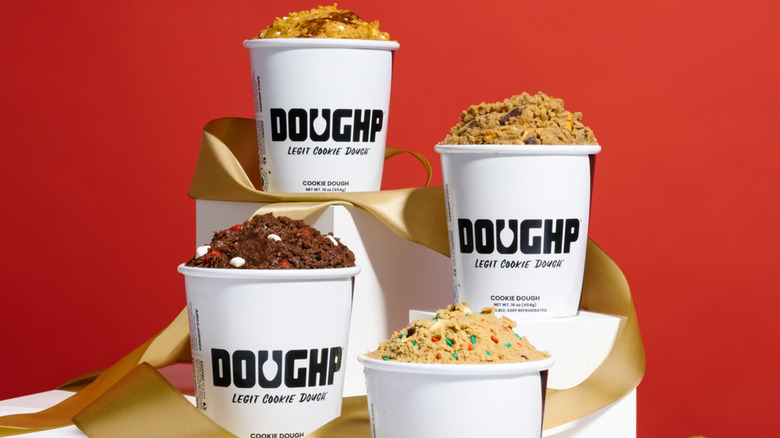 Three containers of Doughp chocolate cookie dough