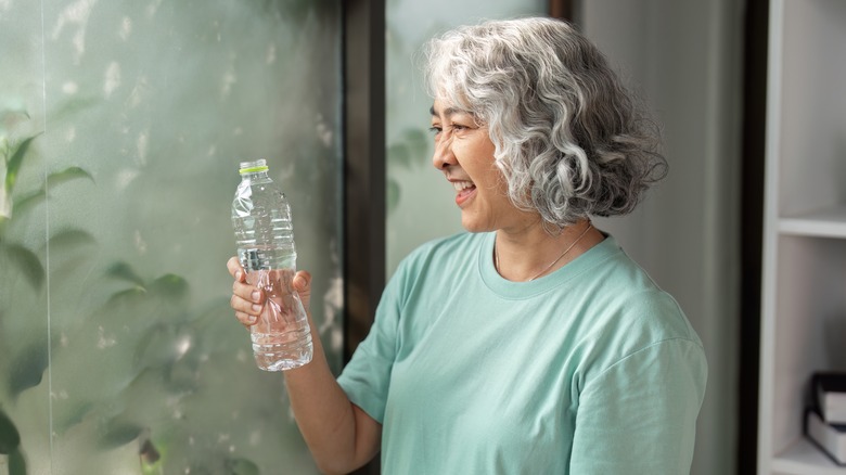 A woman with a bottle of water