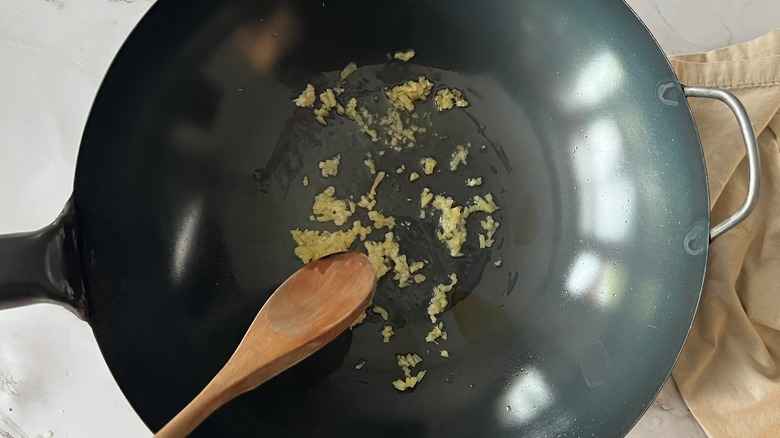 sauteing ginger garlic in wok
