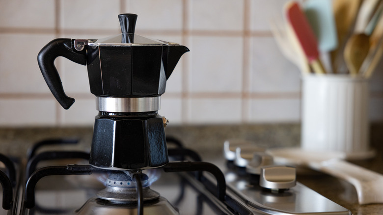 A moka pot on a stovetop